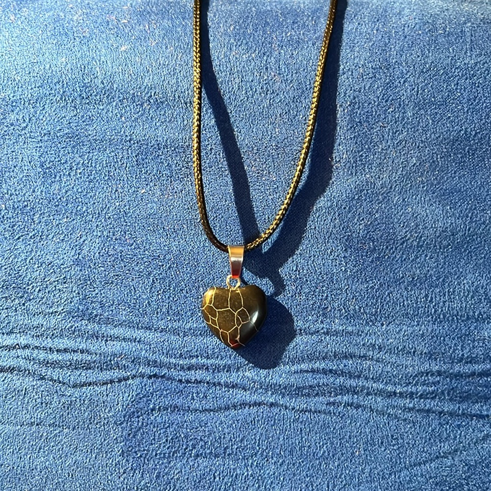 Black with white lines hart pendant‎ necklace.